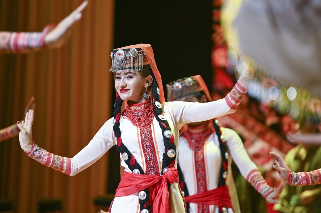 Ethnic charm of young dancer glows on stage of Pamir Plateau